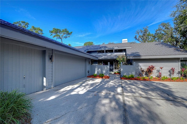 single story home with a garage