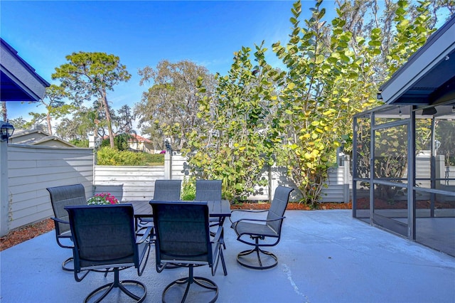 view of patio / terrace with a lanai