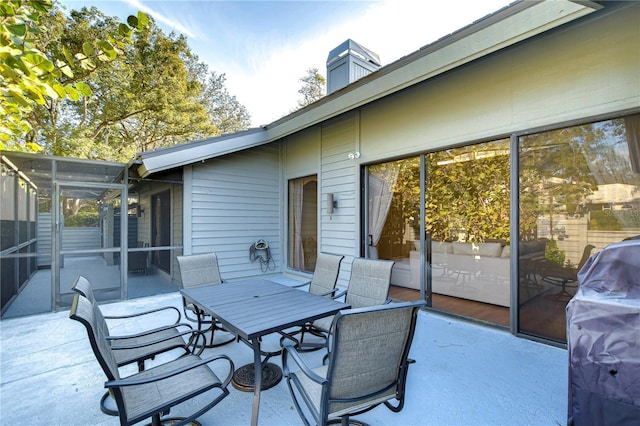 view of patio featuring a sunroom and area for grilling