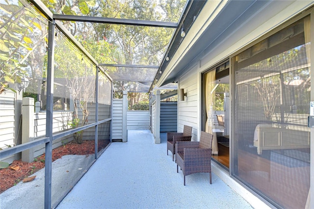 view of patio / terrace with a lanai