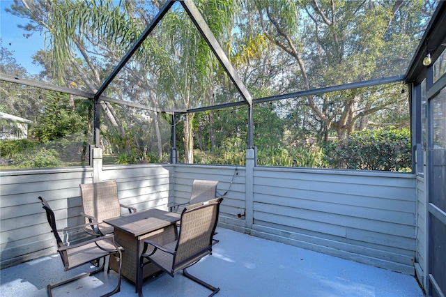 view of patio / terrace featuring a lanai