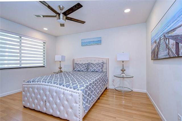 bedroom featuring ceiling fan and hardwood / wood-style flooring