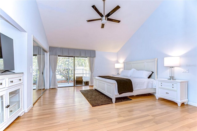 bedroom with high vaulted ceiling, ceiling fan, light wood-type flooring, and access to outside