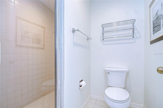 bathroom with toilet, tile patterned flooring, and walk in shower