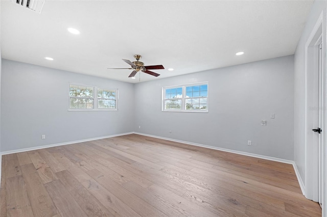 empty room with light hardwood / wood-style flooring and ceiling fan