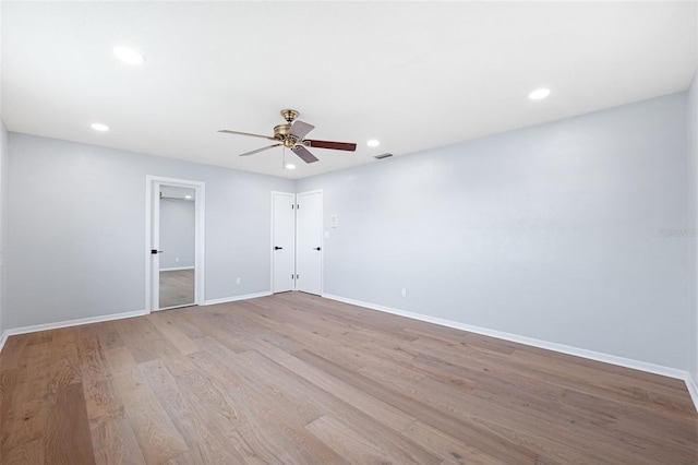 unfurnished room featuring ceiling fan and light hardwood / wood-style flooring