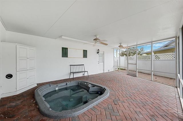 sunroom with a jacuzzi