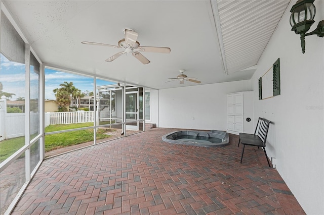 sunroom / solarium featuring ceiling fan