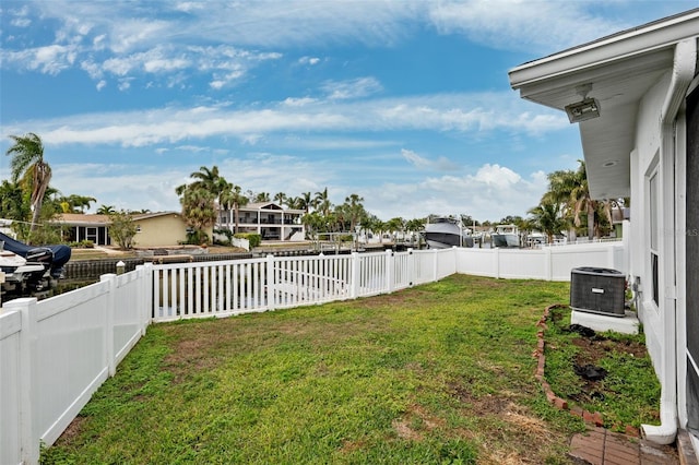 view of yard with central AC unit