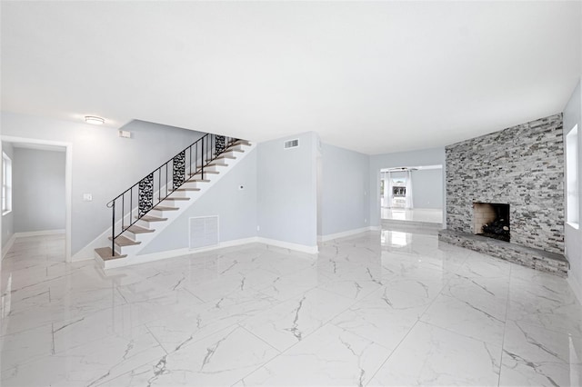 unfurnished living room with a fireplace