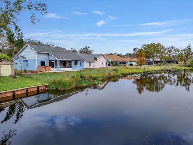 rear view of house with a water view