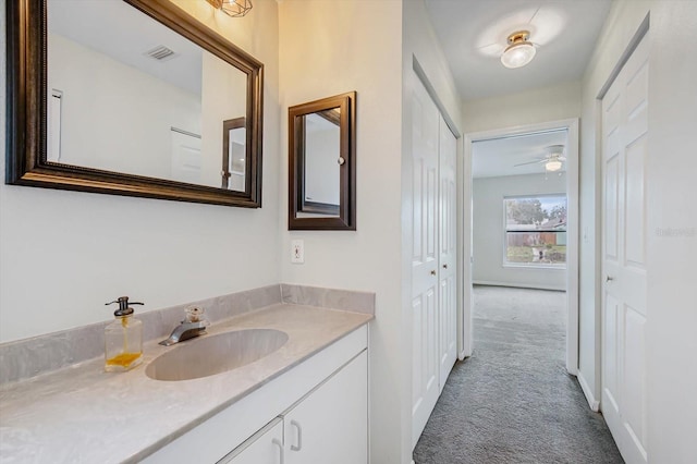 bathroom featuring vanity and ceiling fan