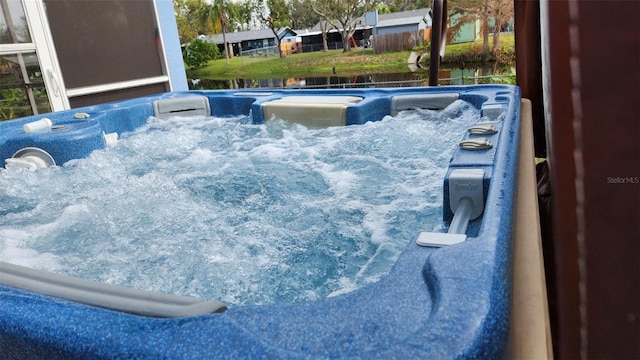 view of pool featuring a hot tub