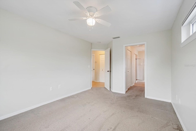 empty room with light carpet and ceiling fan