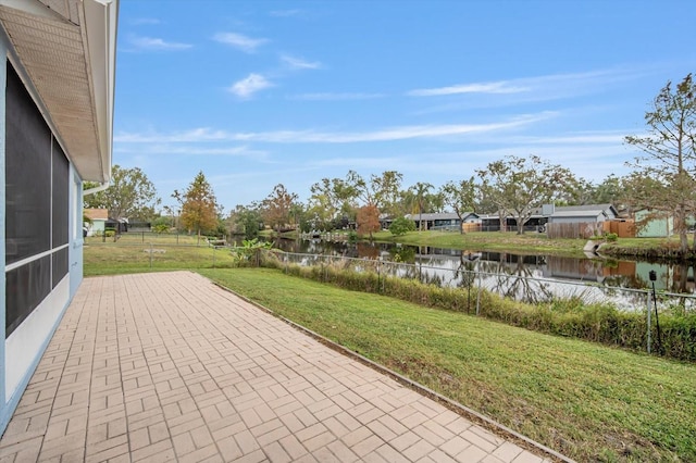 view of patio with a water view