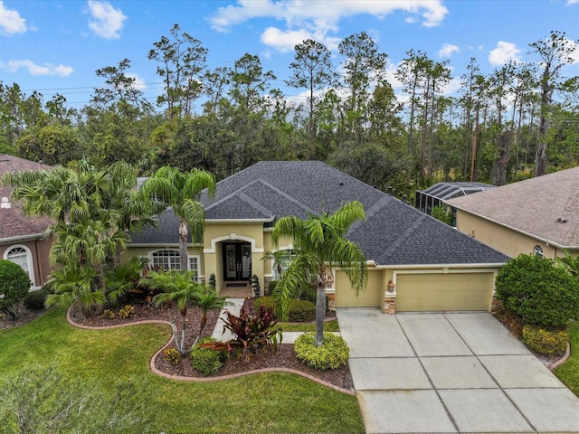 view of front of home with a front lawn and a garage