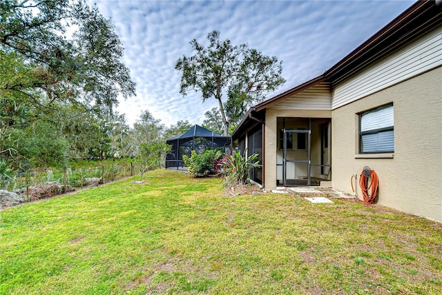 view of yard featuring a lanai