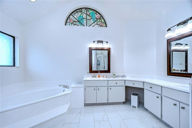 bathroom featuring vanity and a tub