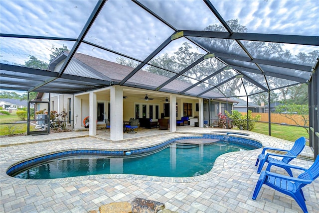 view of pool featuring an outdoor living space, a patio area, ceiling fan, and a lanai