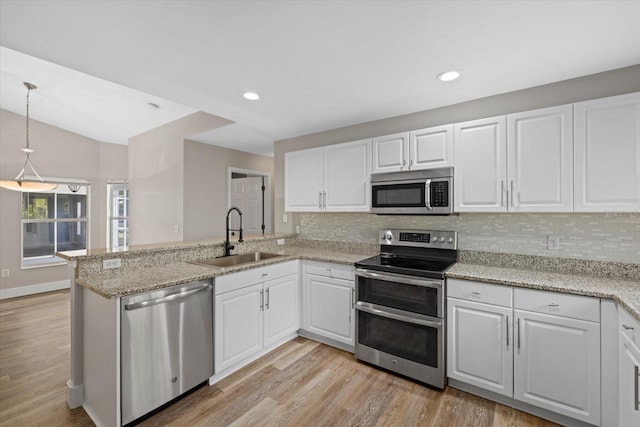 kitchen with white cabinets, sink, and stainless steel appliances