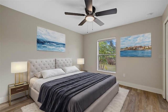 bedroom featuring ceiling fan and hardwood / wood-style flooring