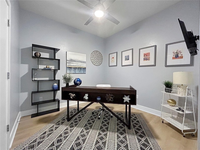 office with ceiling fan and wood-type flooring