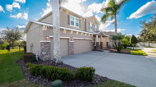 view of front of property with a garage and a front yard