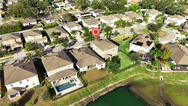 birds eye view of property with a water view