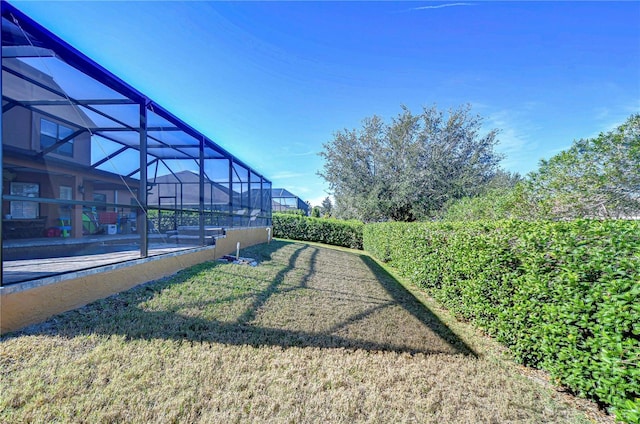 view of yard with a lanai