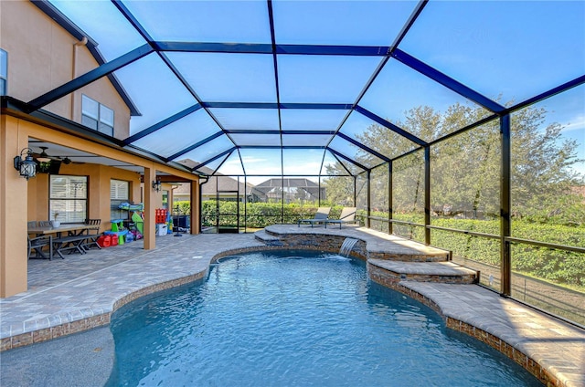 outdoor pool with a lanai and a patio