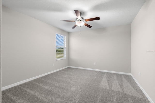 unfurnished room featuring carpet and ceiling fan