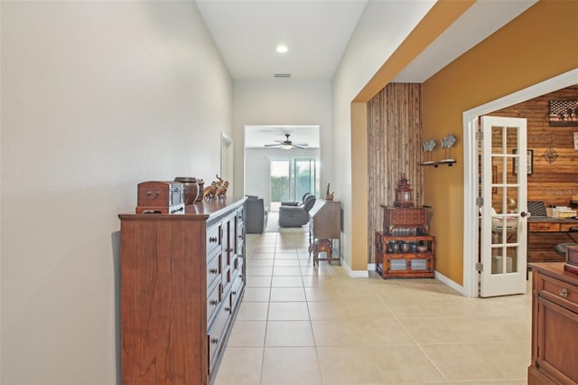 hall with light tile patterned floors and french doors