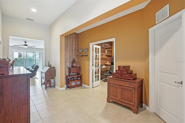 hall featuring light tile patterned flooring