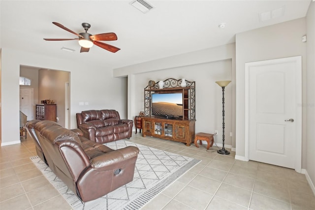 tiled living room featuring ceiling fan