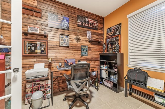 tiled office space featuring rustic walls and wooden walls