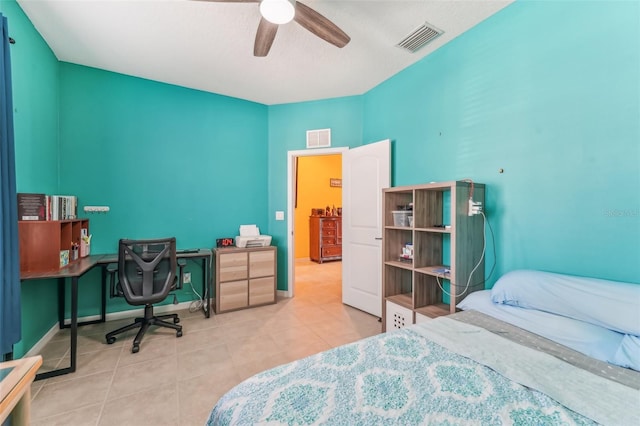 tiled bedroom with ceiling fan