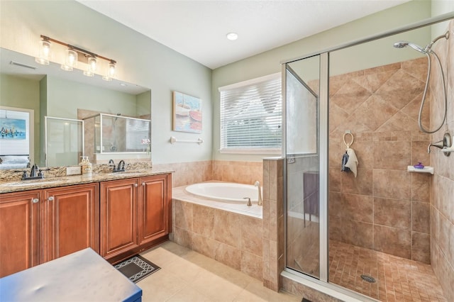 bathroom featuring separate shower and tub, tile patterned flooring, and vanity