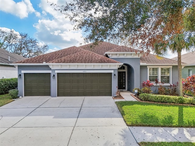 view of front of property with a garage