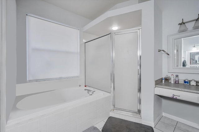 bathroom featuring tile patterned flooring, independent shower and bath, and vaulted ceiling