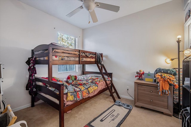 bedroom featuring ceiling fan and light colored carpet