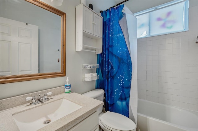 full bathroom with vanity, shower / bath combination with curtain, and toilet