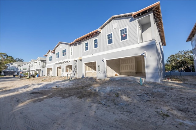 multi unit property featuring a garage