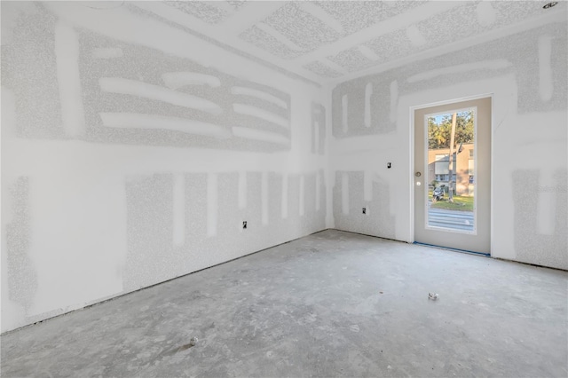 spare room featuring concrete flooring