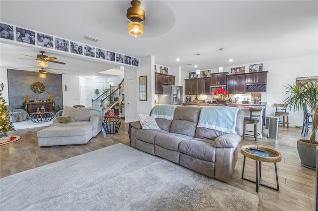 living room featuring ceiling fan