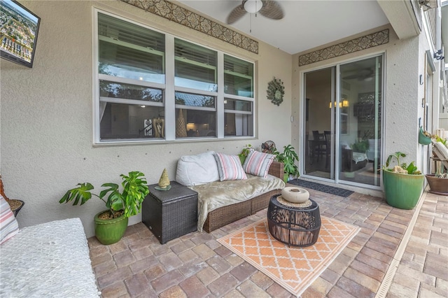 view of patio featuring ceiling fan