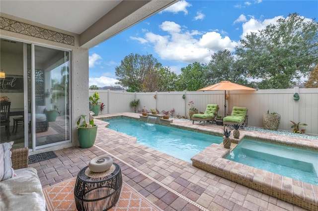 view of swimming pool featuring an in ground hot tub and pool water feature