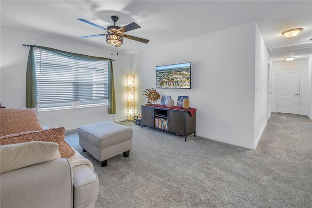 carpeted living room featuring ceiling fan