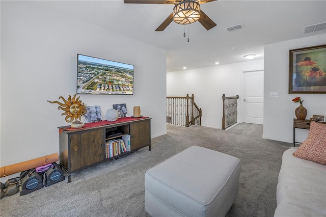 living room with carpet floors and ceiling fan