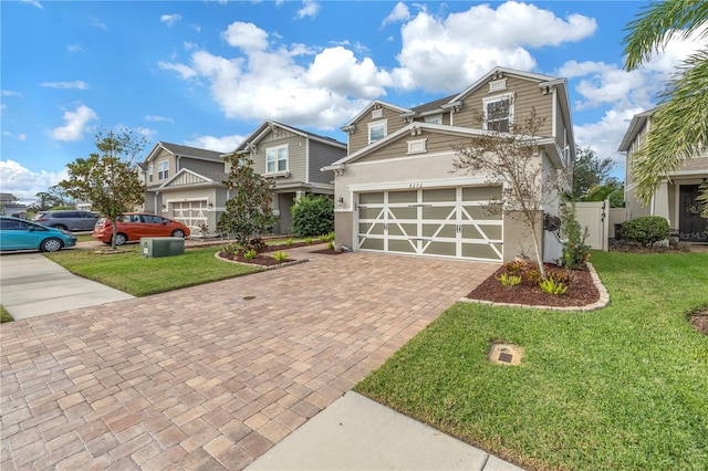 craftsman inspired home with a front yard and a garage