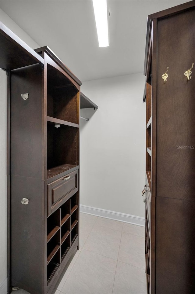 walk in closet featuring light tile patterned floors